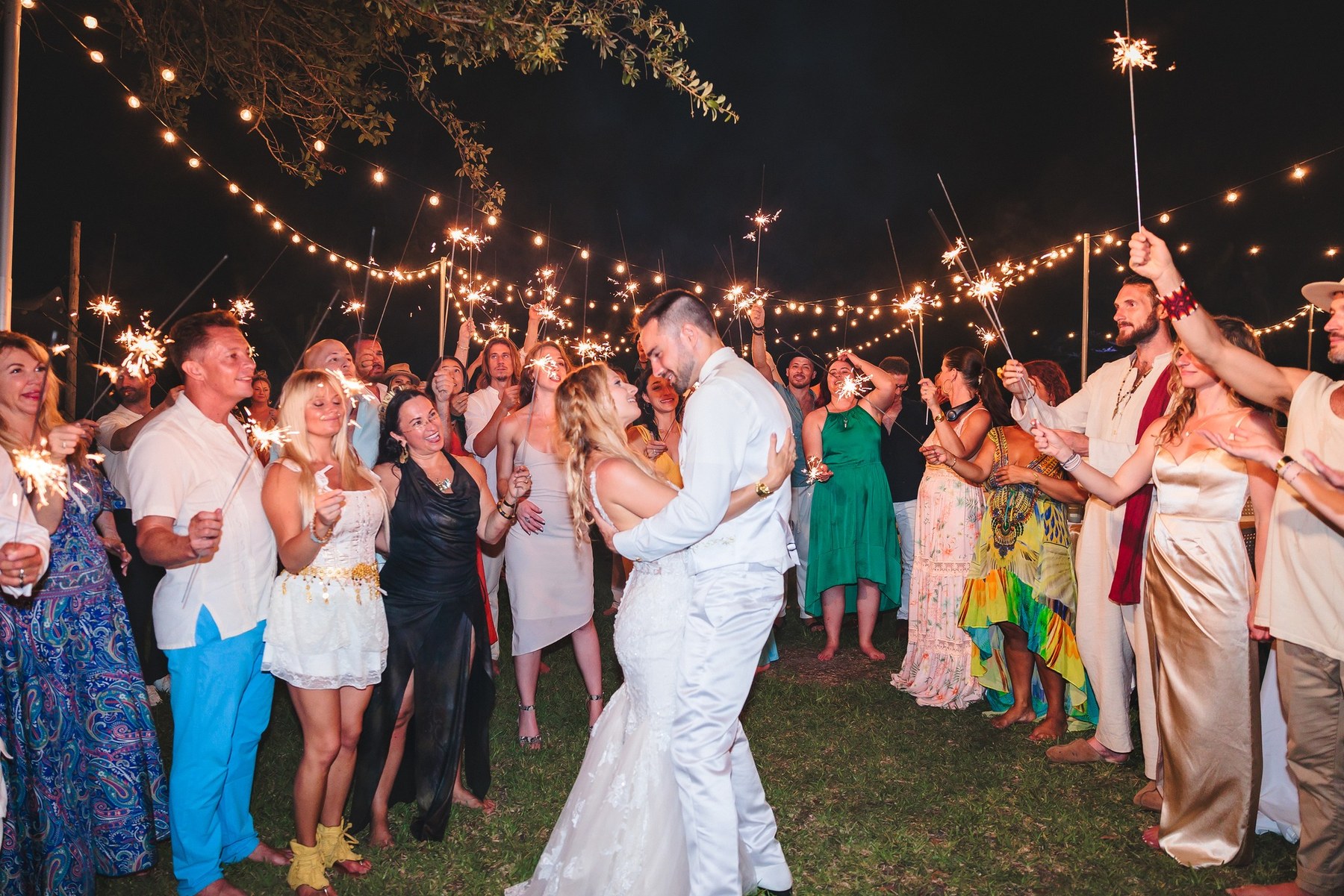 Joe and Kelly dancing under sparklers at their wedding in Florida